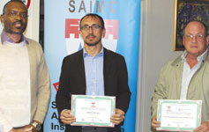 Branch chairman Solly Mabitsela (l) thanking Gerard McKeogh and Klaas Cronje with certificates of appreciation.